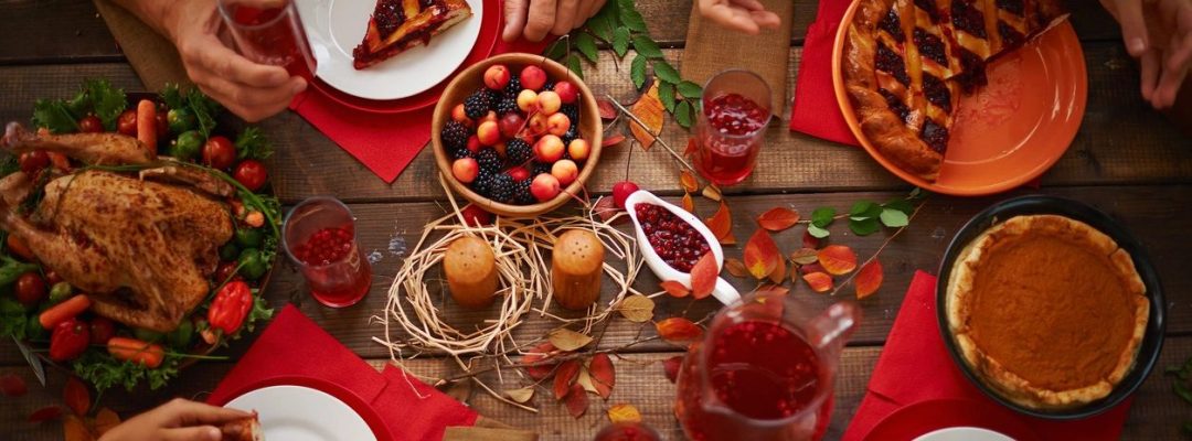 People eating a pie and drinking cranberry compote